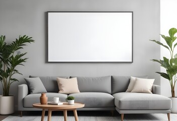 A modern living room with a large blank white frame on the wall above a gray sectional sofa, a wooden coffee table, and a potted plant.