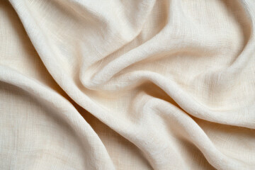 Close-up of soft, cream-colored fabric with delicate texture, showcasing smooth folds and natural patterns. Ideal for backgrounds and textile designs.