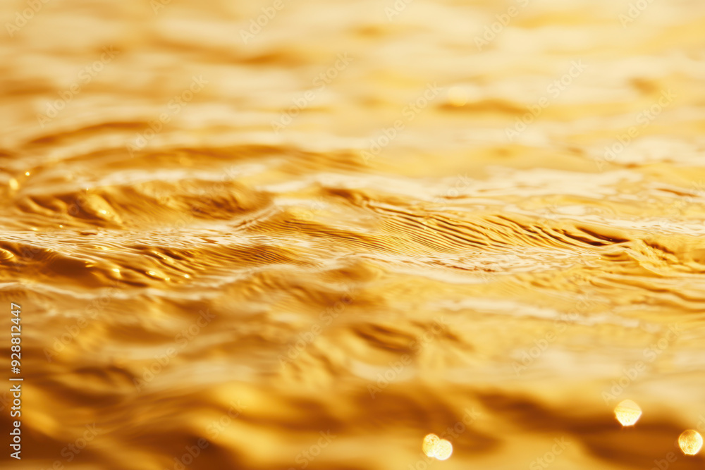 Poster close-up of golden ripples on water surface, creating a mesmerizing and tranquil texture. perfect fo