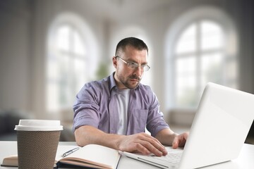 Fototapeta premium Happy teenager guy studying with laptop computer