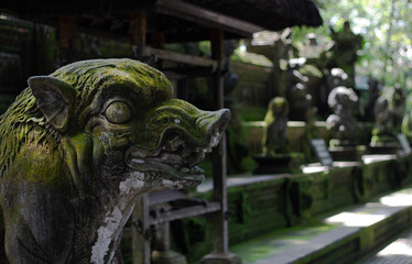 Ancient Stone Sculptures Nestled Within Lush Greenery and Vibrant Nature