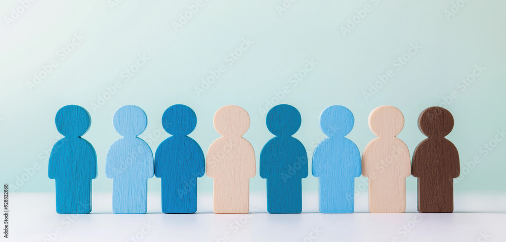 Aufkleber colorful wooden figures representing diversity and inclusion stand in a row against a light blue bac
