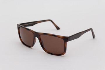 brown sport glasses on white background