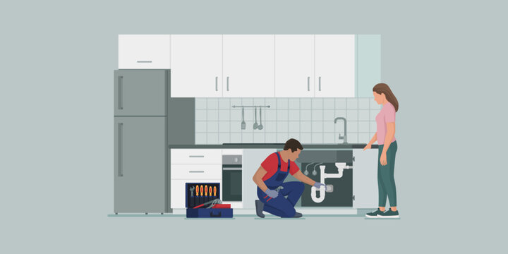 Professional plumber fixing a kitchen sink drain