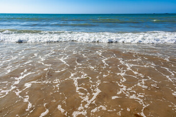 Seaside and waves, beach with sand, water, shell