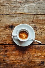 A warm cup of freshly brewed coffee resting on a marble table in a cozy caf