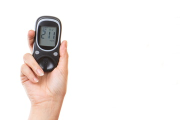 Hand holding glucose meter with high result sugar level. Checking sugar level during diabetes. Place for inscription