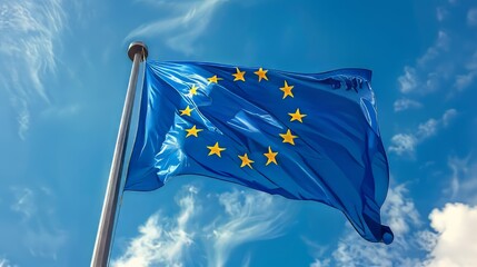 the flying flag of the european union against the high blue sky 