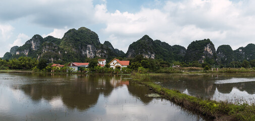 Fototapeta premium Northern Vietnam, typical landscape with village in the red River Delta. Ninh Binh Area