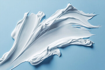 Cosmetic smears of cream presented on a blue background
