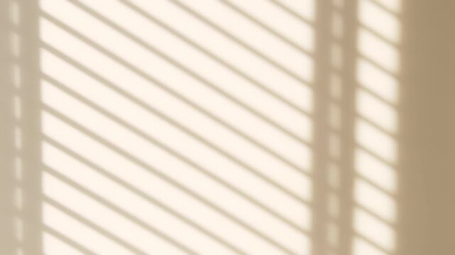 The light from the window blinds on the wall, the shadow lines from the curtain, blurry shadows and silhouettes.. Mockup, copy space for text
