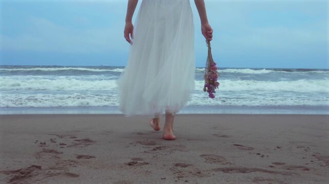 person walking on the beach