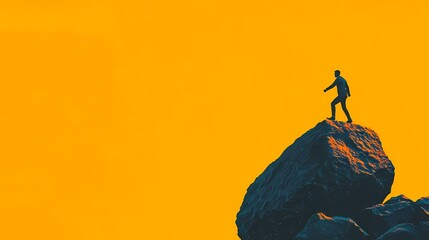A lone figure stands atop a large rock against a vibrant orange backdrop, symbolizing achievement and solitude in nature.
