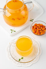 Sea buckthorn tea drink with oranges and mint. Autumn comfort hot drink. Herbal vitamin tea. 