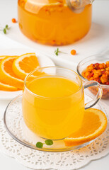 Sea buckthorn tea drink with oranges and mint. Autumn comfort hot drink. Herbal vitamin tea. 