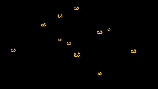 Halloween Jack-o'-Lanterns silhouette with its eyes and mouth glowing falling from top on black background. Happy Halloween, abstract background.