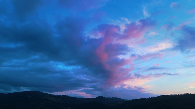 Pink clouds at sunset on the coast of Cantabria seen from a drone. Cantabria. Spain. Europe