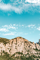 Majestic towering mountain peaks under a vibrant clear blue sky