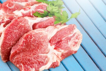 Tasty fresh meat raw steaks on  desk