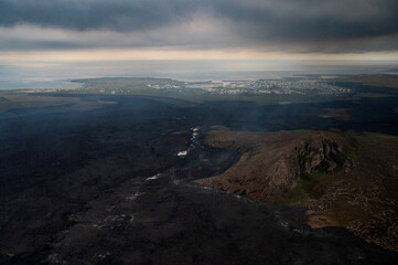 Grindavik Iceland and the steaming lava from the most recent volcanic eruption