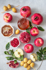 Rosh Hashanah (jewish New Year holiday) concept.Traditional symbols: pomegranate, apples, honey