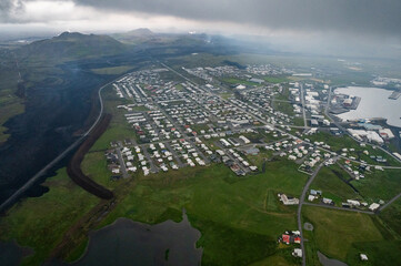 Grindavik Iceland with new lava flows coming over the road towards town