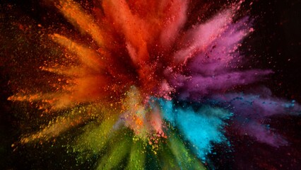 Colored powder explosion on black background . Freeze motion.