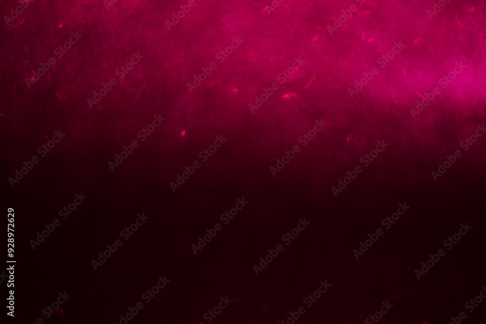 Poster a pink background with a blurry pink object in the foreground. the background is dark and the object
