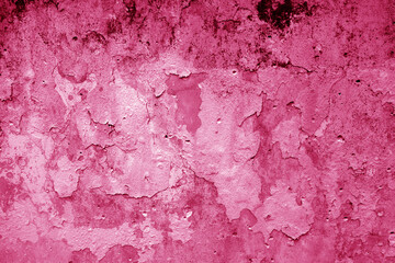 Peeling paint on grungy plaster wall. Pink style.