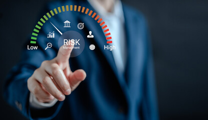 Businesswoman analyzing risk and opportunities to planning business via risk level indicator...
