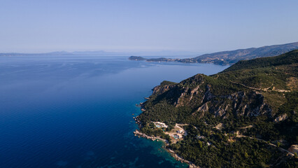 Obraz premium Aerial view of expensive residential houses in island small town Syvota Greece. American dream homes as example of real estate development in US suburbs