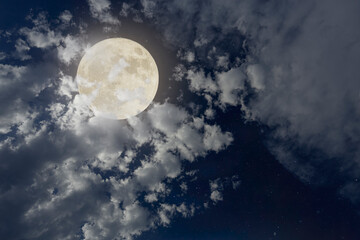 Cloudy full moon night sky
