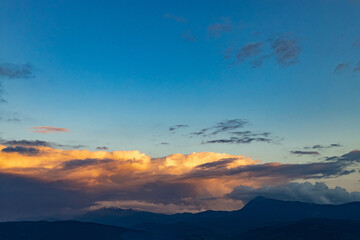 Beautiful landscape with clouds in the mountains at sunrise.