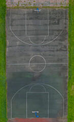Aerial View of Worn Outdoor Basketball Court