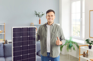 Portrait of happy, smiling man who has had positive experience using clean and cheap solar energy,...