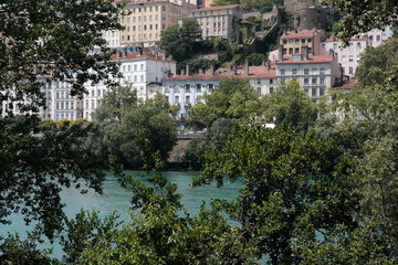 Obraz premium View of Lyon and Rhone river through the baranches of the tree on sunny summer day, France.