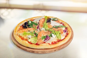 Delicious fresh pizza with vegetables on the desk