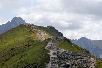 
landscape in the mountains with a path along the mountain ridge