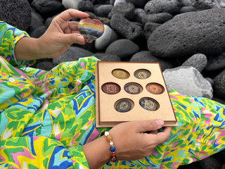 Hand holding chakra healing crystals. Witchcraft, herbal medicine and healing, Magic healing Rock...
