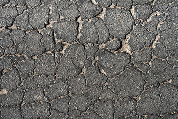 Cracked asphalt texture. Top view. Asphalt. Road background