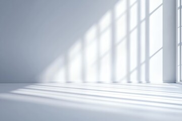 Obraz premium A minimalist interior scene with soft light and shadows creating a serene atmosphere on a white background.