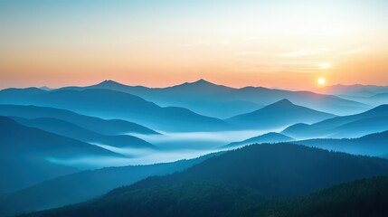 Obraz premium A serene mountain landscape at sunrise, with mist rolling over the peaks