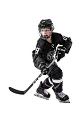 Full length profile shot of a boy in a black hockey uniform shooting a puck Isolated on transparent background.