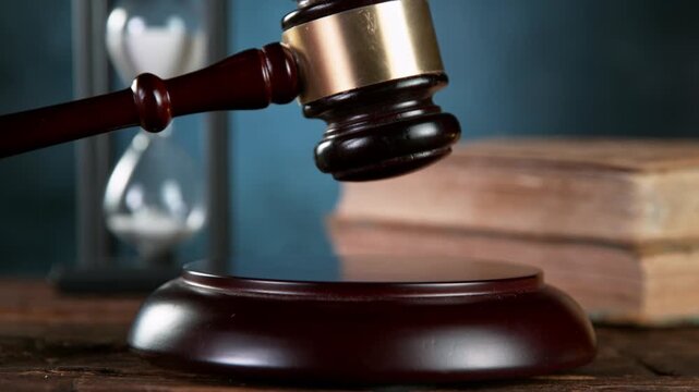 Super slow motion of gavel being struck to decide an auction or guilty verdict in court . Filmed on high speed cinematic camera at 1000 fps