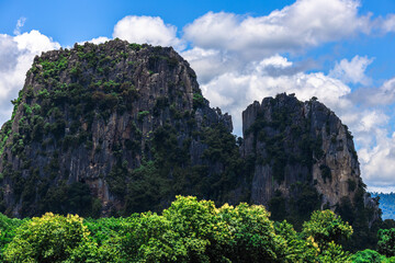 Natural background, high angle view from the observation point, blurred golden rays of the sun visible. The mountains that were setting on the horizon, changed beautifully with the wind.