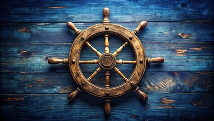 Obraz premium Rustic, distressed wooden steering wheel, adorned with worn brass fittings, rests on a faded navy blue background, evoking nostalgic memories of bygone nautical adventures.