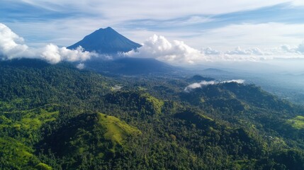Aerial View of a Lush Green Mountain Range with a Majestic Peak Rising Above the Clouds