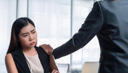 An empathetic gesture in the workplace as a colleague comforts a distressed employee during a challenging moment.