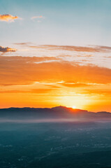 Morning sunrise landscape with mountains horizon