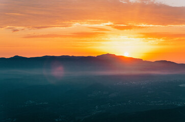 Morning sunrise landscape with mountains horizon